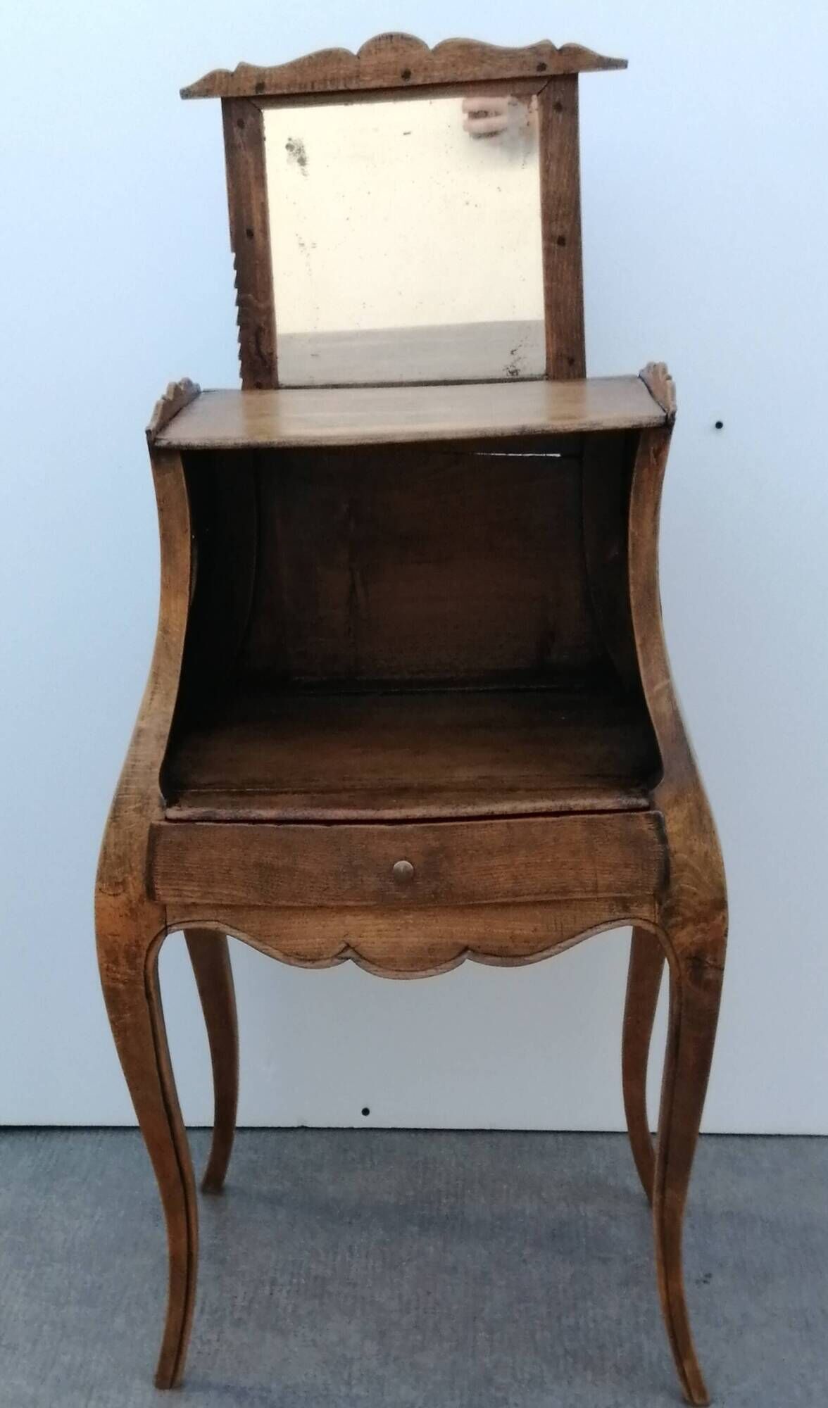 Belly bedside table with Louis XV style walnut mirror early 20th century 1920.