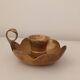 Brass candle holder in the shape of a flower.