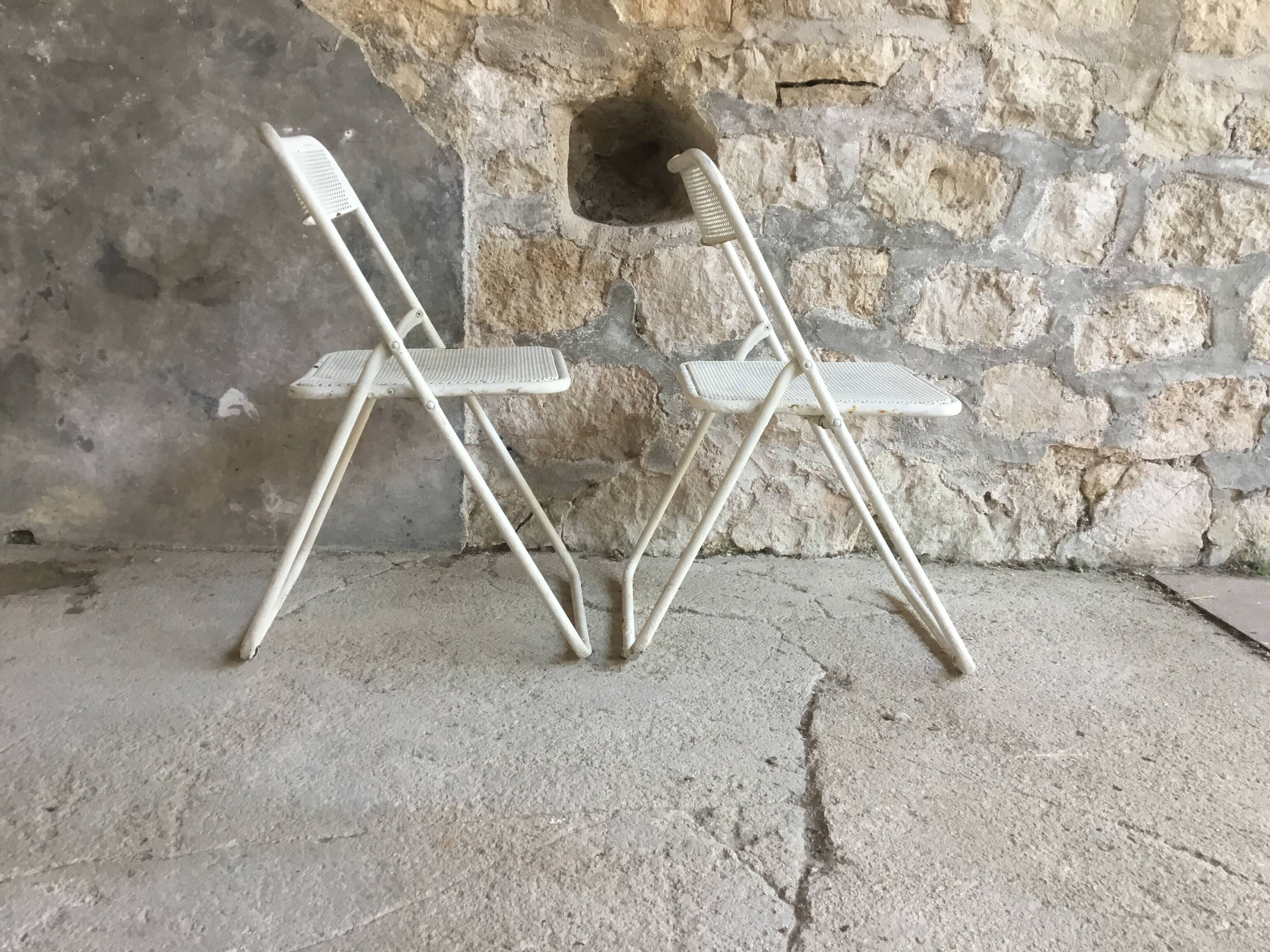 Pair of white perforated metal folding chairs - vintage