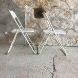 Pair of white perforated metal folding chairs - vintage