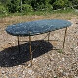 Oval coffee table in veined green marble