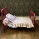 pink metal doll bed