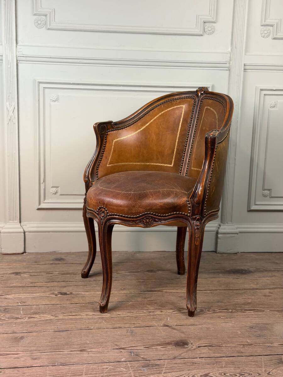 Louis XV style office chair in carved wood, brown leather, circa 1920.