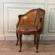 Louis XV style office chair in carved wood, brown leather, circa 1920.