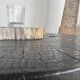Black mango wood tripod side table with a semi-spherical top, height: 45 cm, diameter: 44 cm.