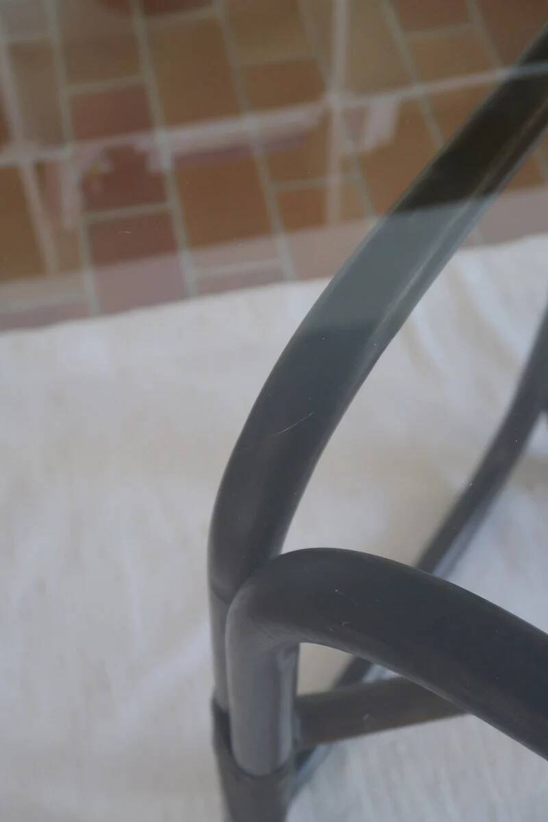 Round dining table in rattan, smoked glass top, 1970s.