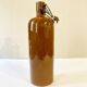 Bottle / hot water bottle in brown enamelled stoneware