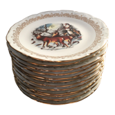 12 French porcelain game plates with gilding