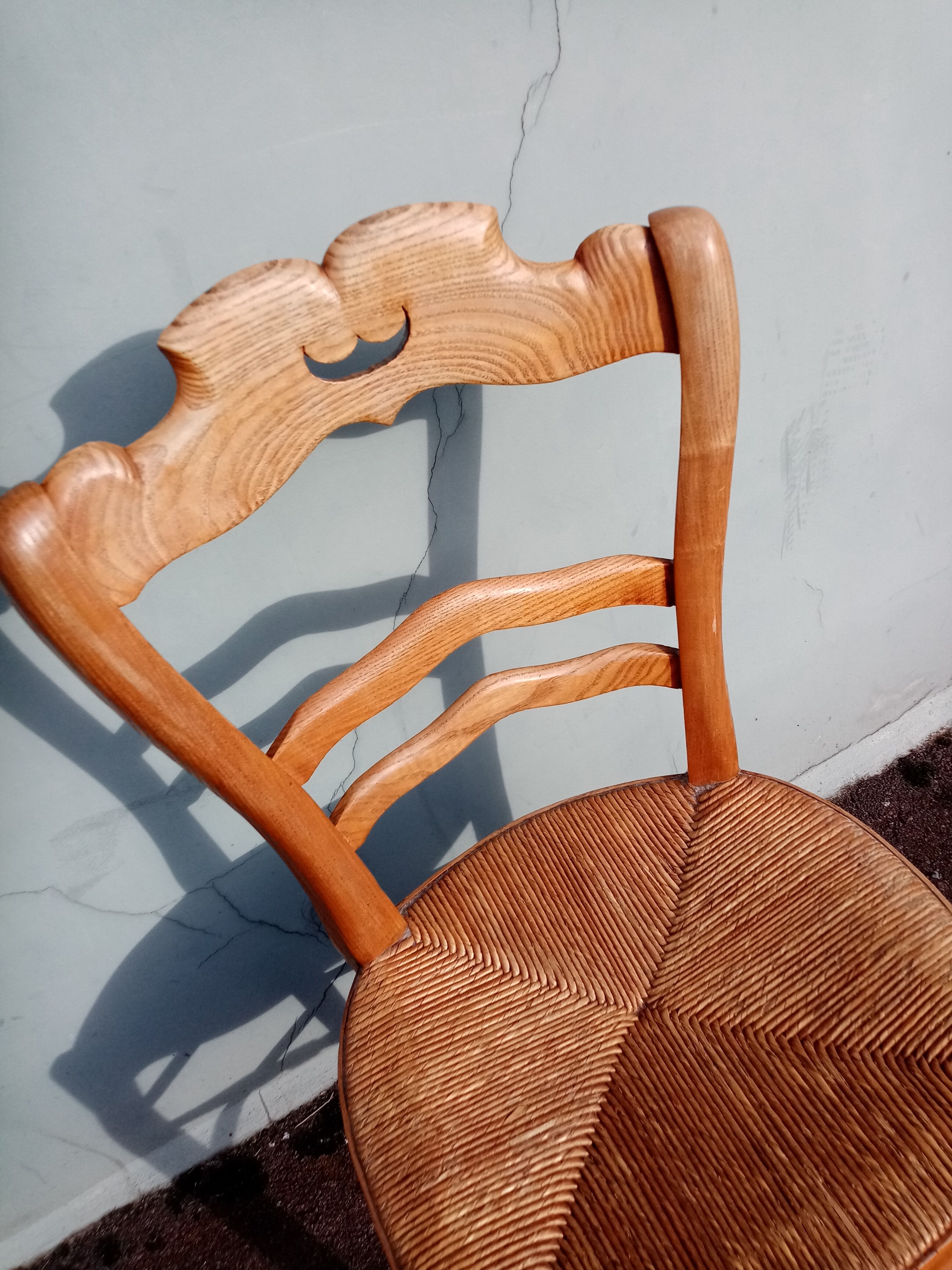 Antique wooden chair seated straw mustache