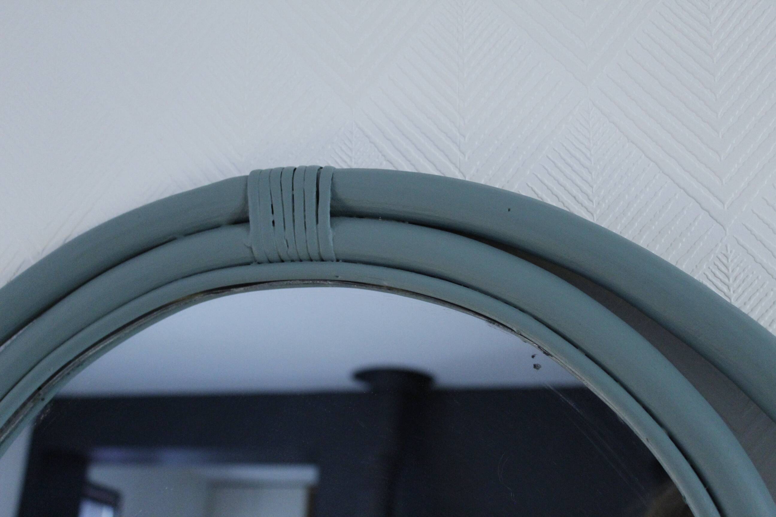 Sage green painted rattan mirror