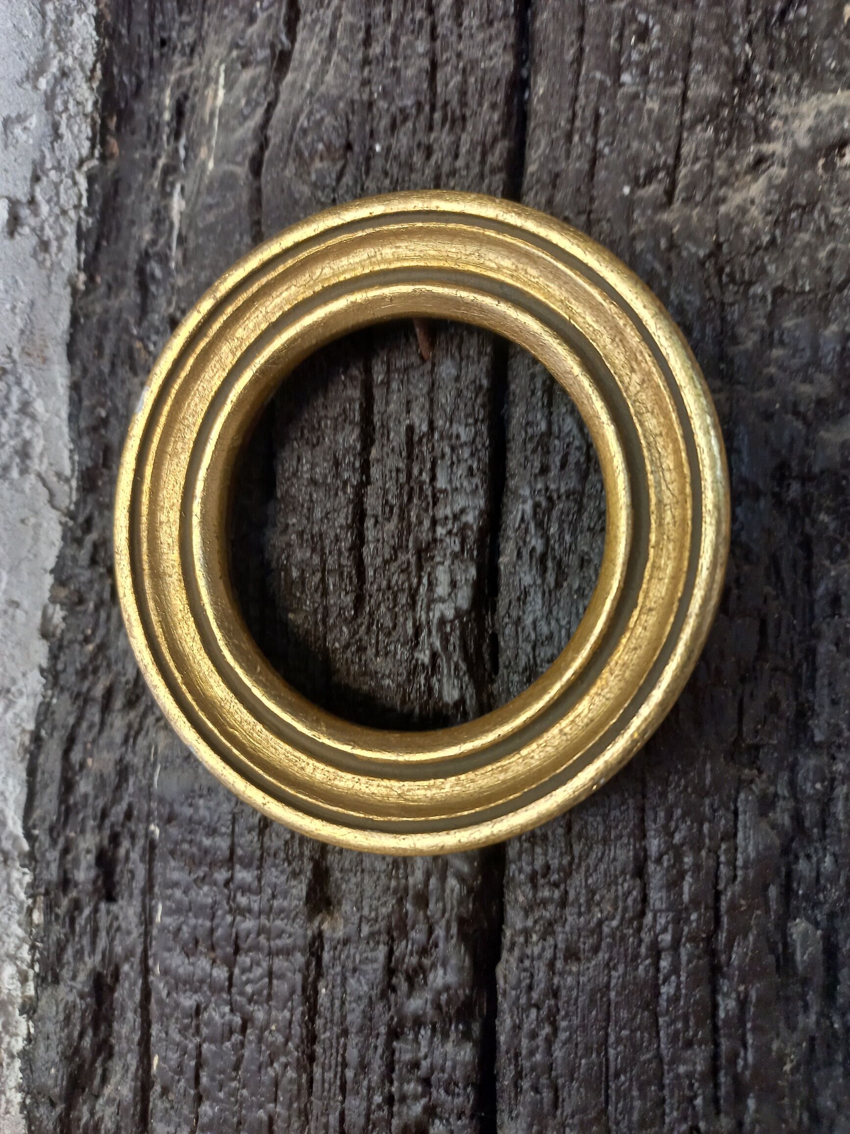 Pair of small round gilded frames
