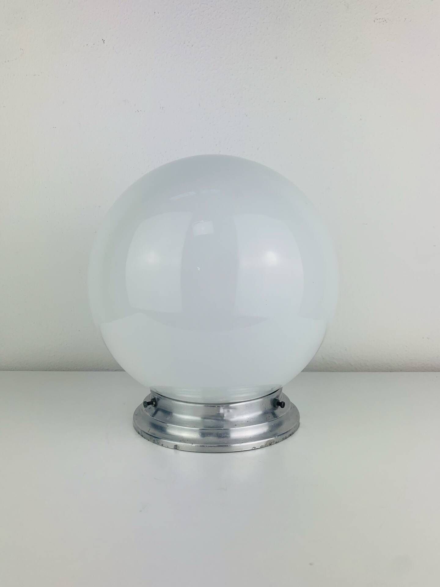 Wall light or ceiling light with opaline globe in Art Deco style.
