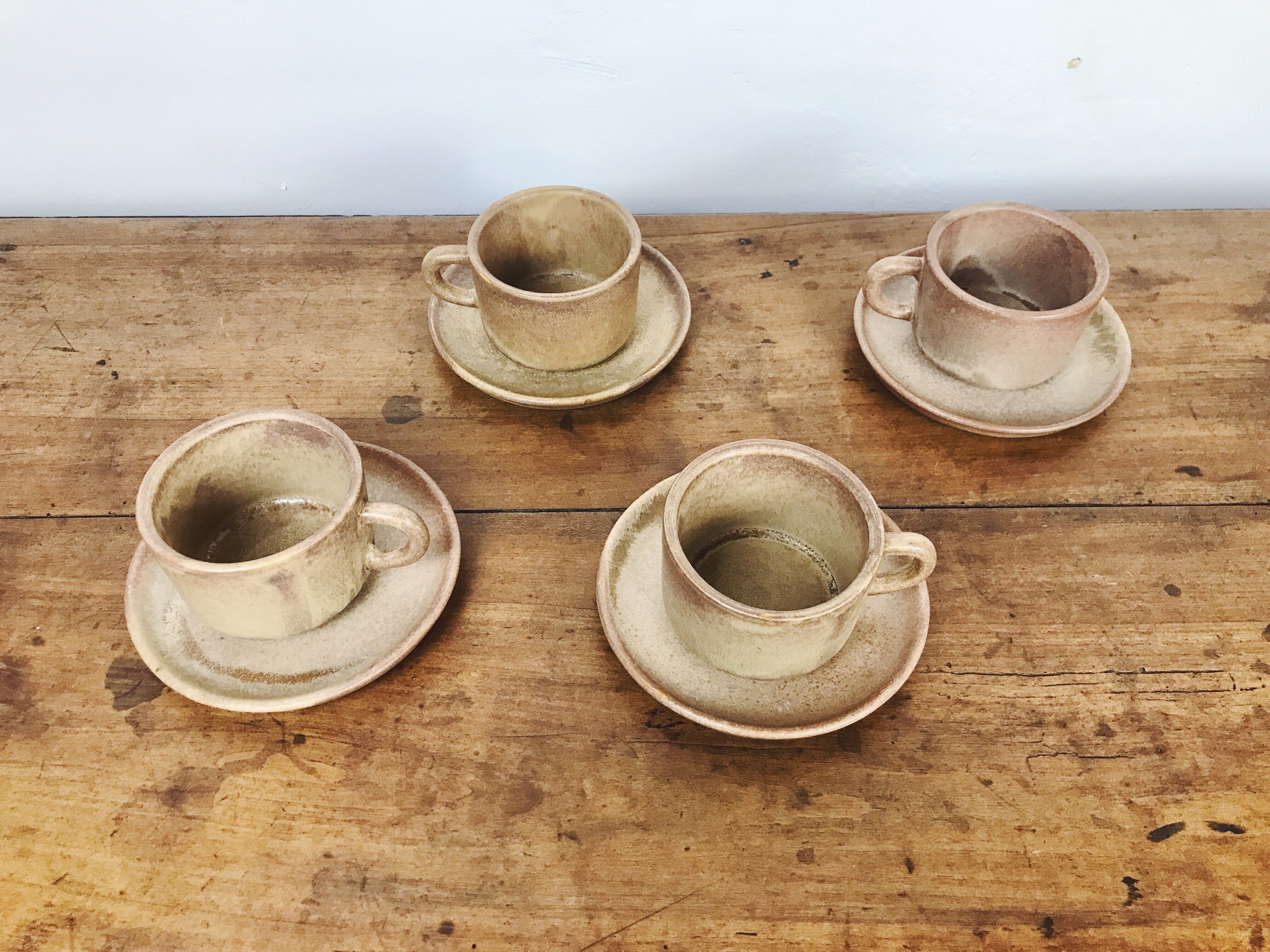 4 sandstone cups with under cups