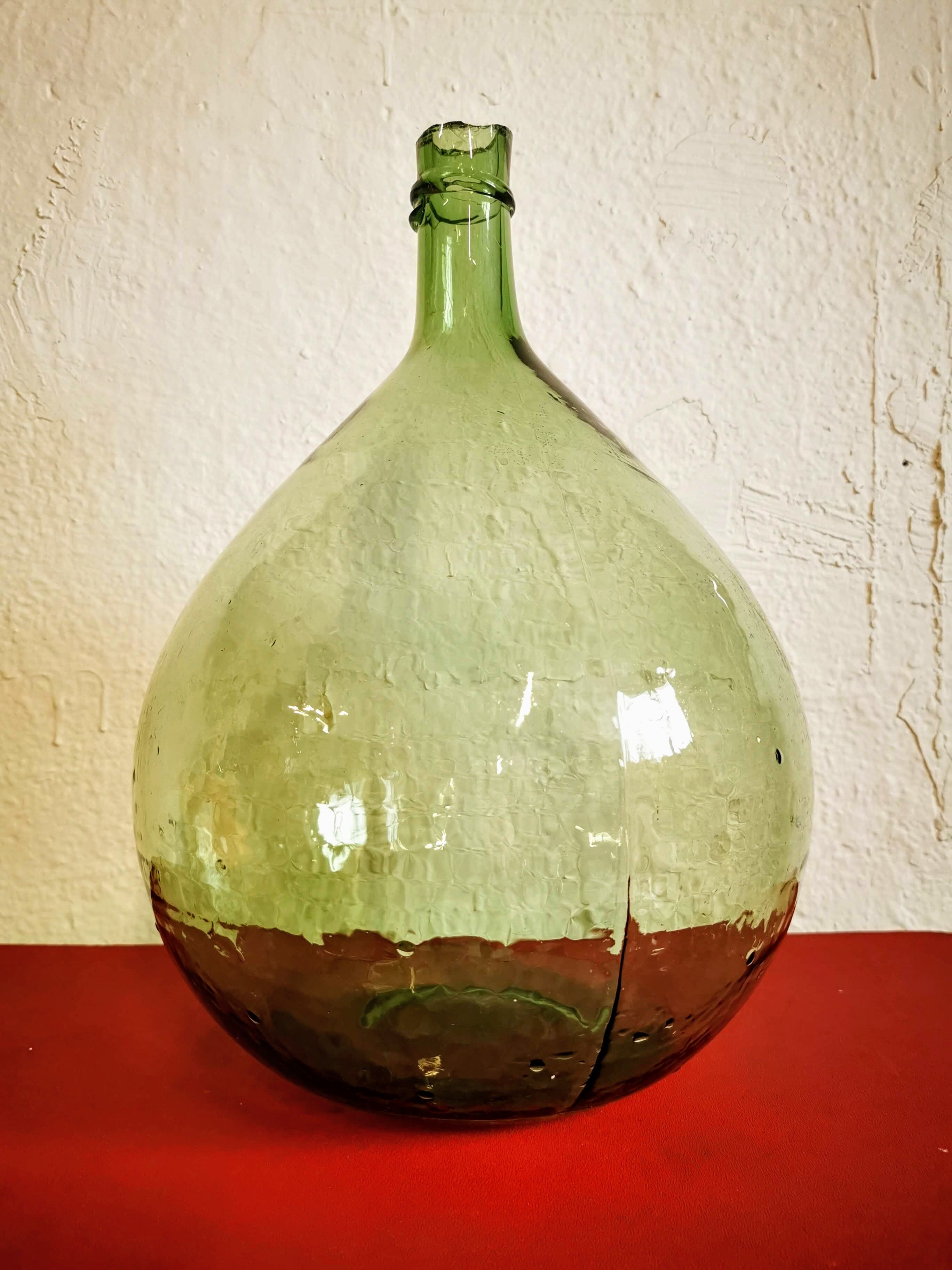 Green demijohn contains 12 liters
