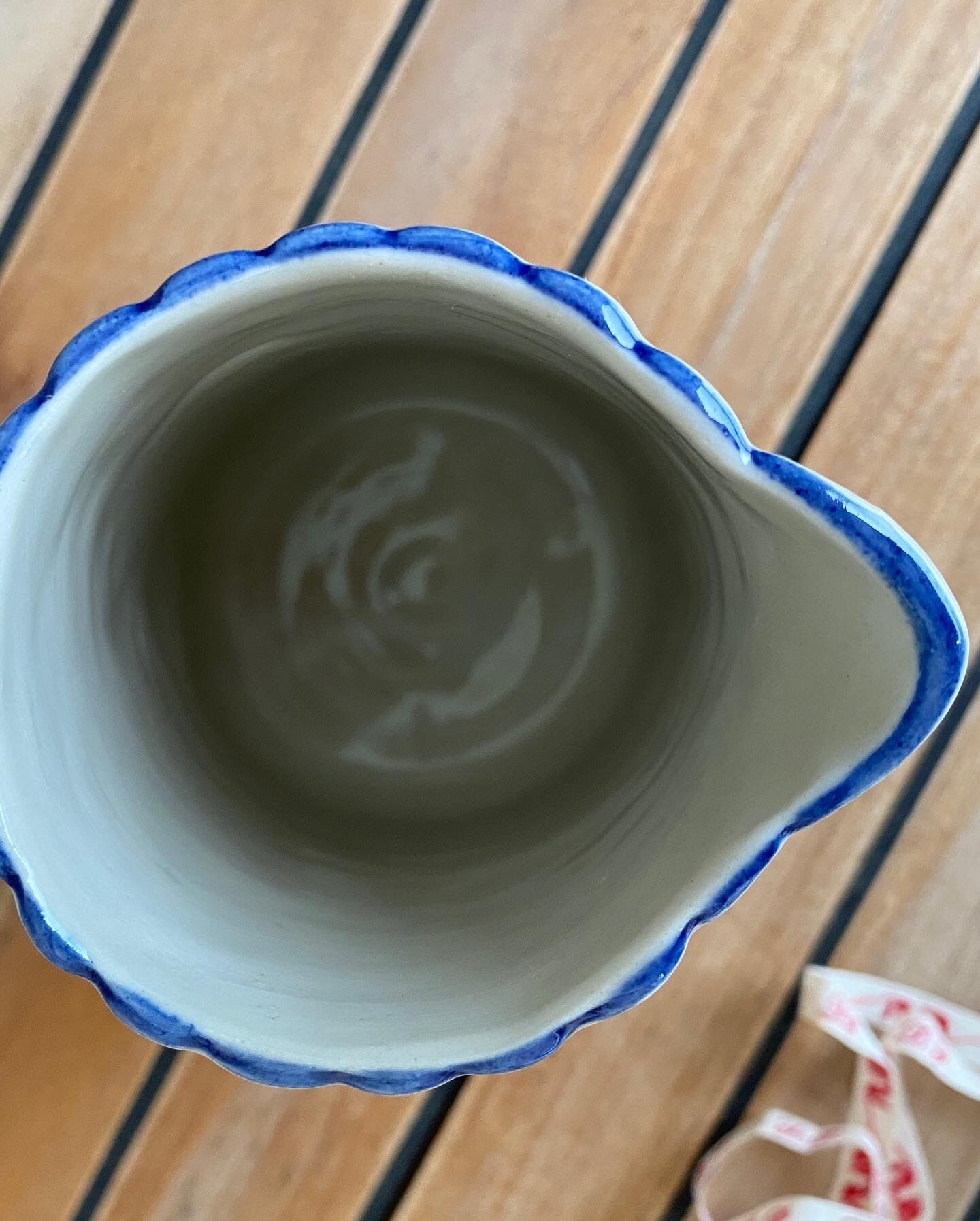 Small pitcher in iron earth with double old decoration