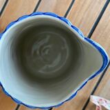 Small pitcher in iron earth with double old decoration