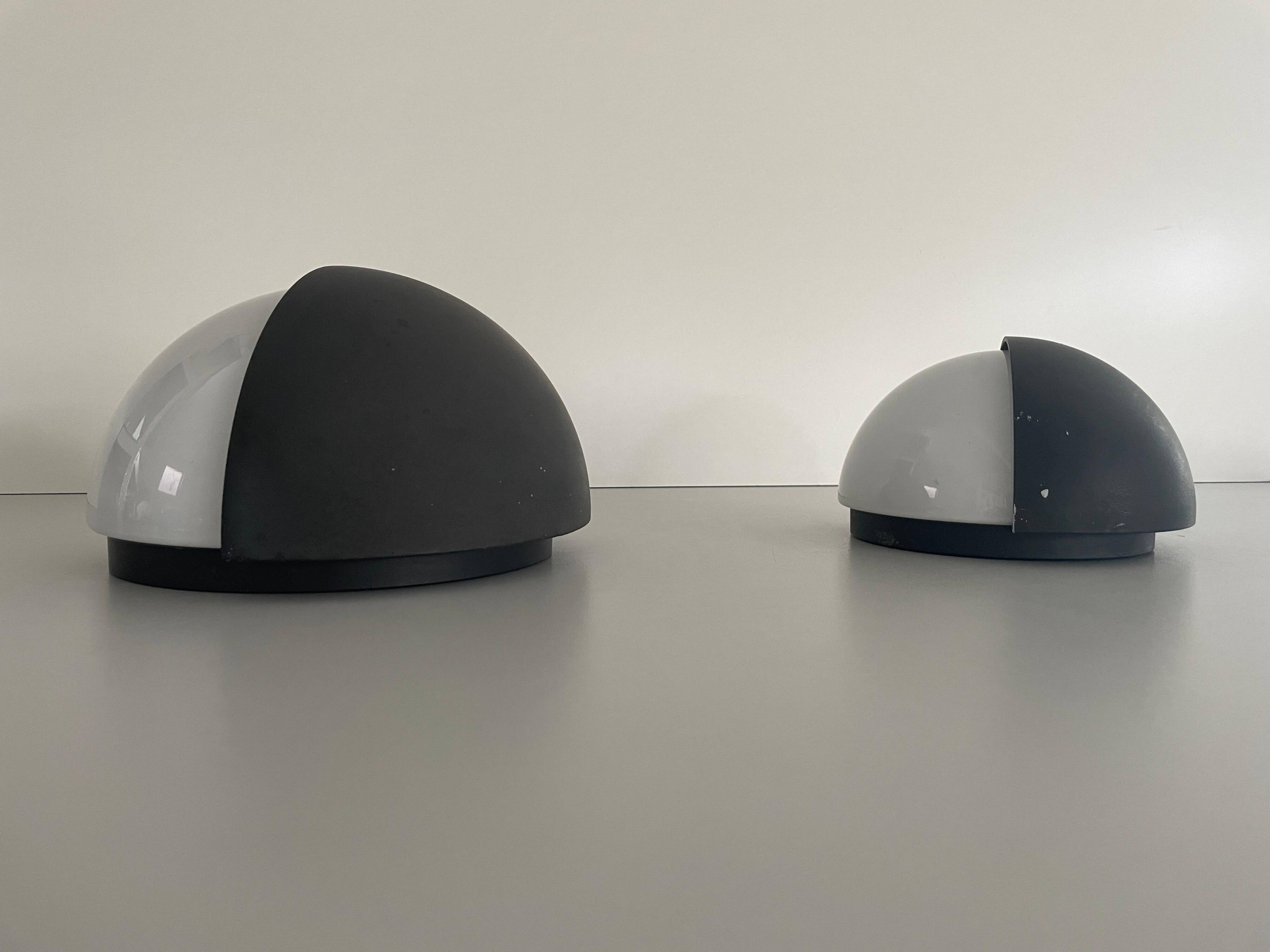 Round black metal wall lights, small and large set, by Bega, 1970s, Germany.