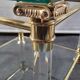 Pair of tables in brass, acrylic and glass