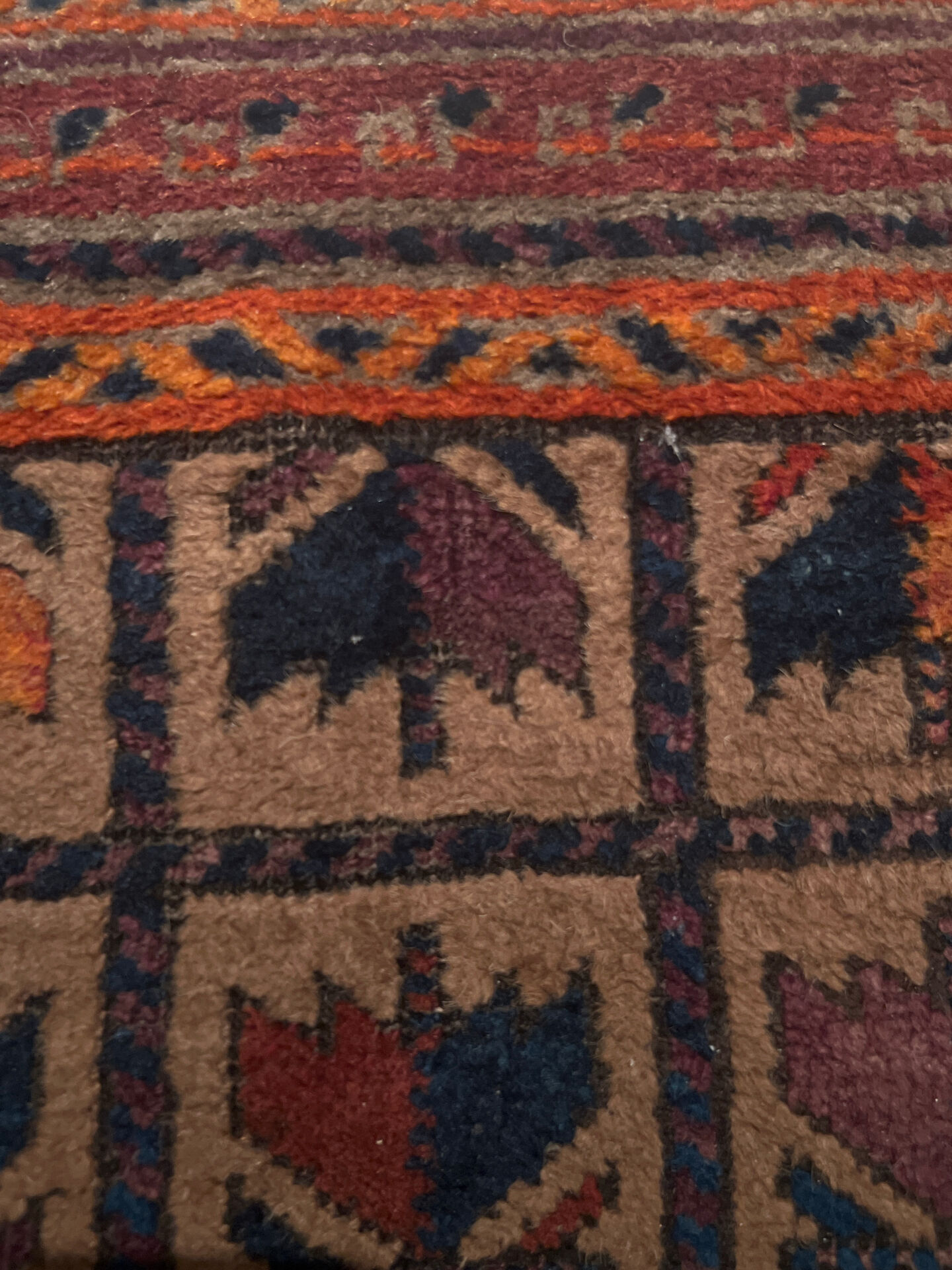 Persian carpet, hand-knotted, geometric design.