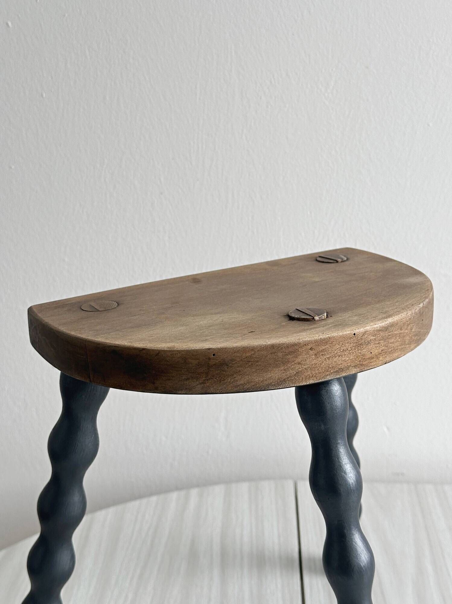 Antique wooden tripod stool with turned legs
