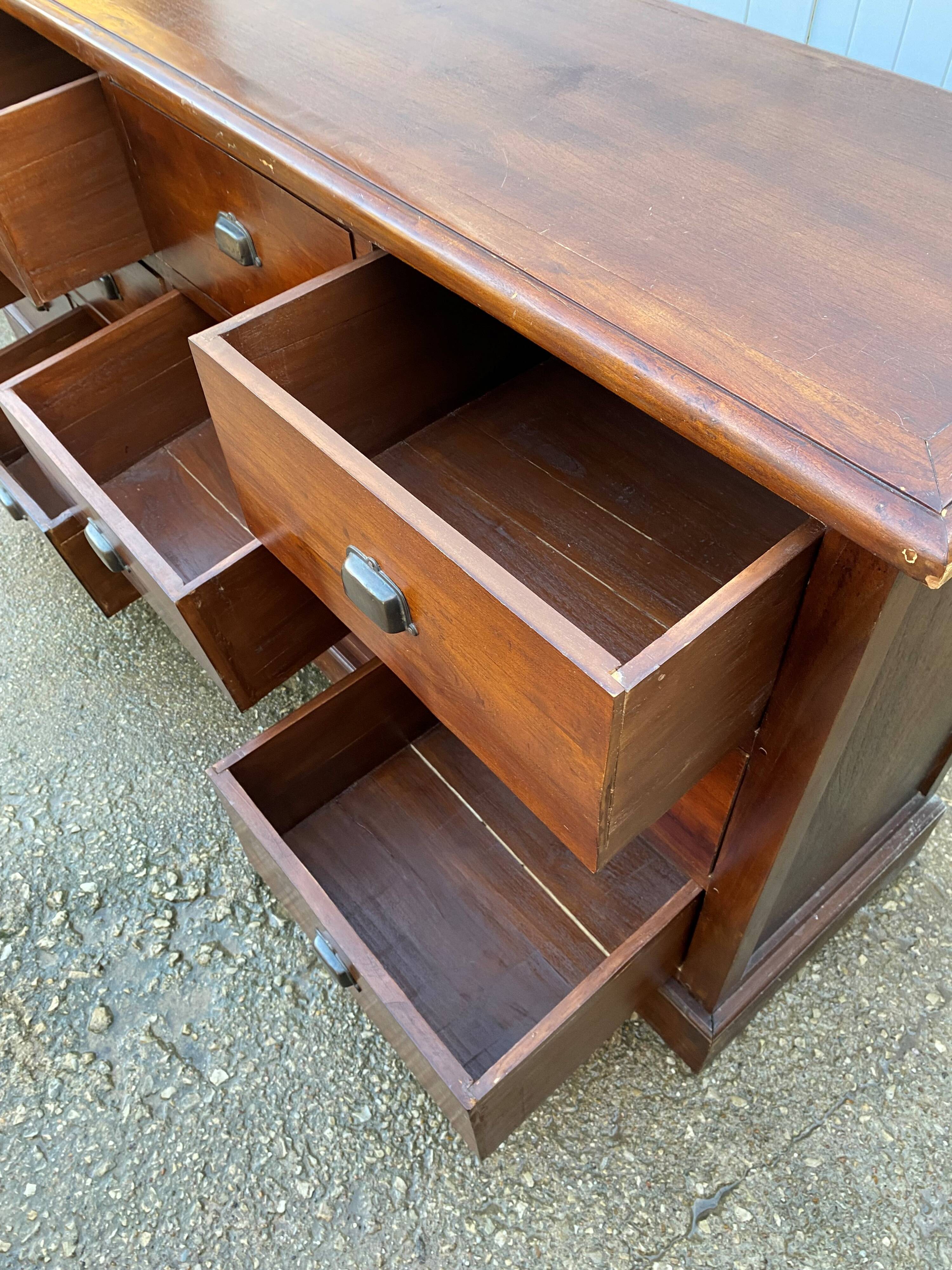 Old and authentic trade storage unit counter with 12 large drawers in cherry wood 1950