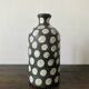 Terracotta vase painted with polka dots