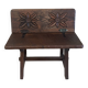 Small antique wooden bench with a folding backrest.