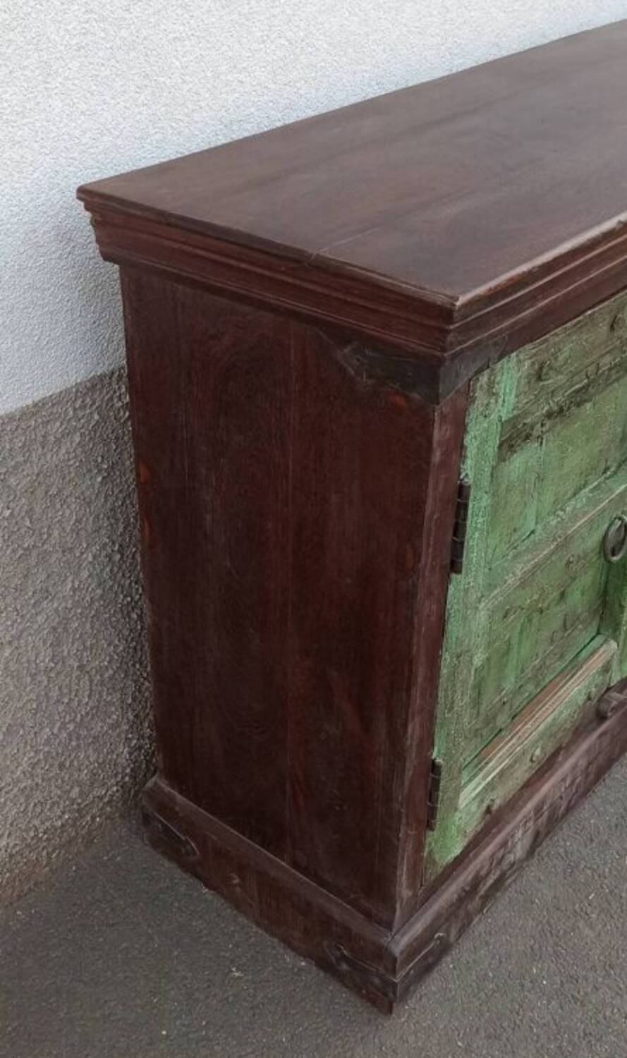 Long wooden sideboard with old green doors