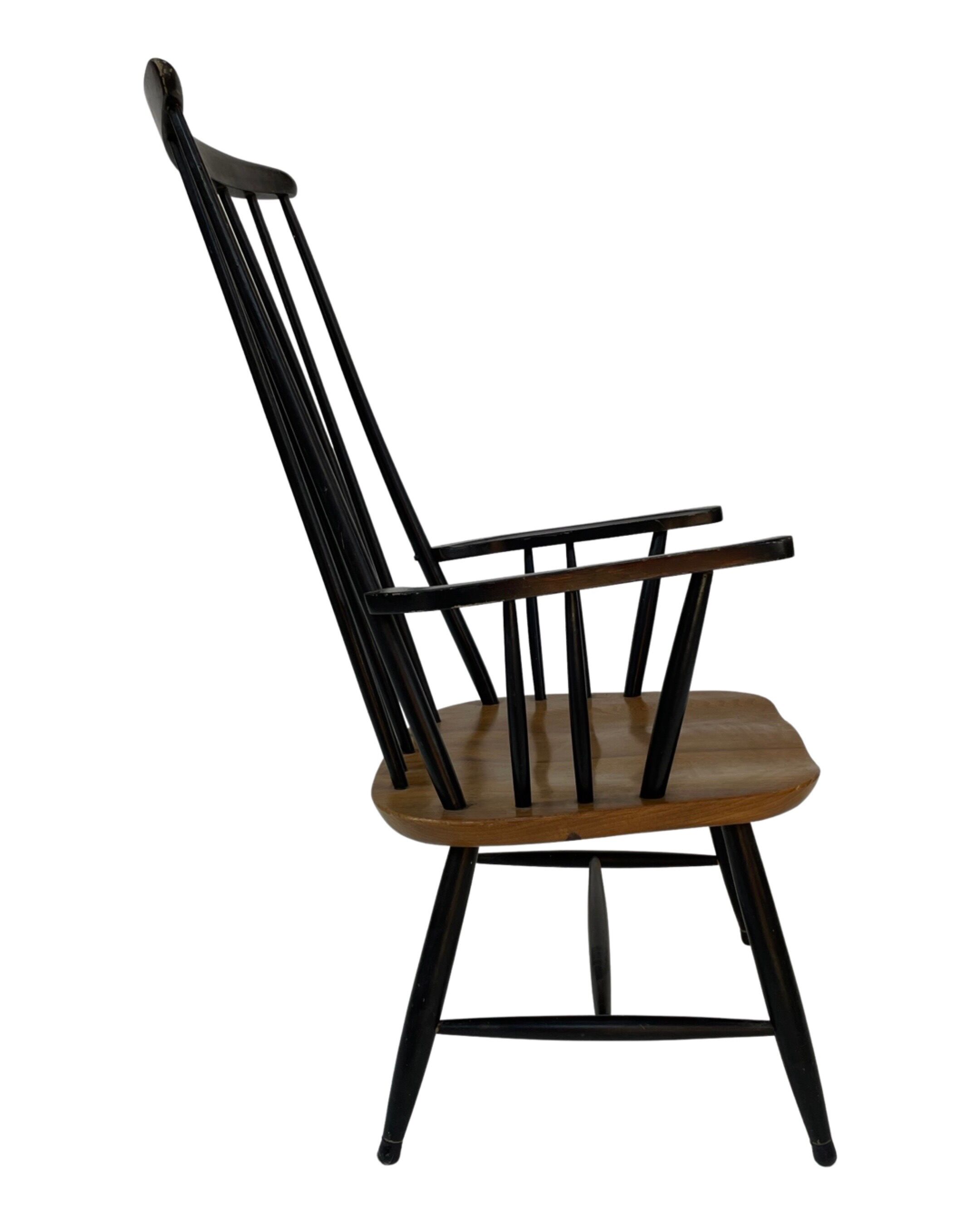 Vintage easy chair with high back and armrest from the 60s