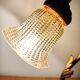 Gold swan neck table lamp with amber tulip glass.