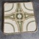 Ceramic tile trivet with vintage pattern woven wicker outline