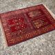 Vintage Afghan hand-knotted prayer rug with Islamic patterns.