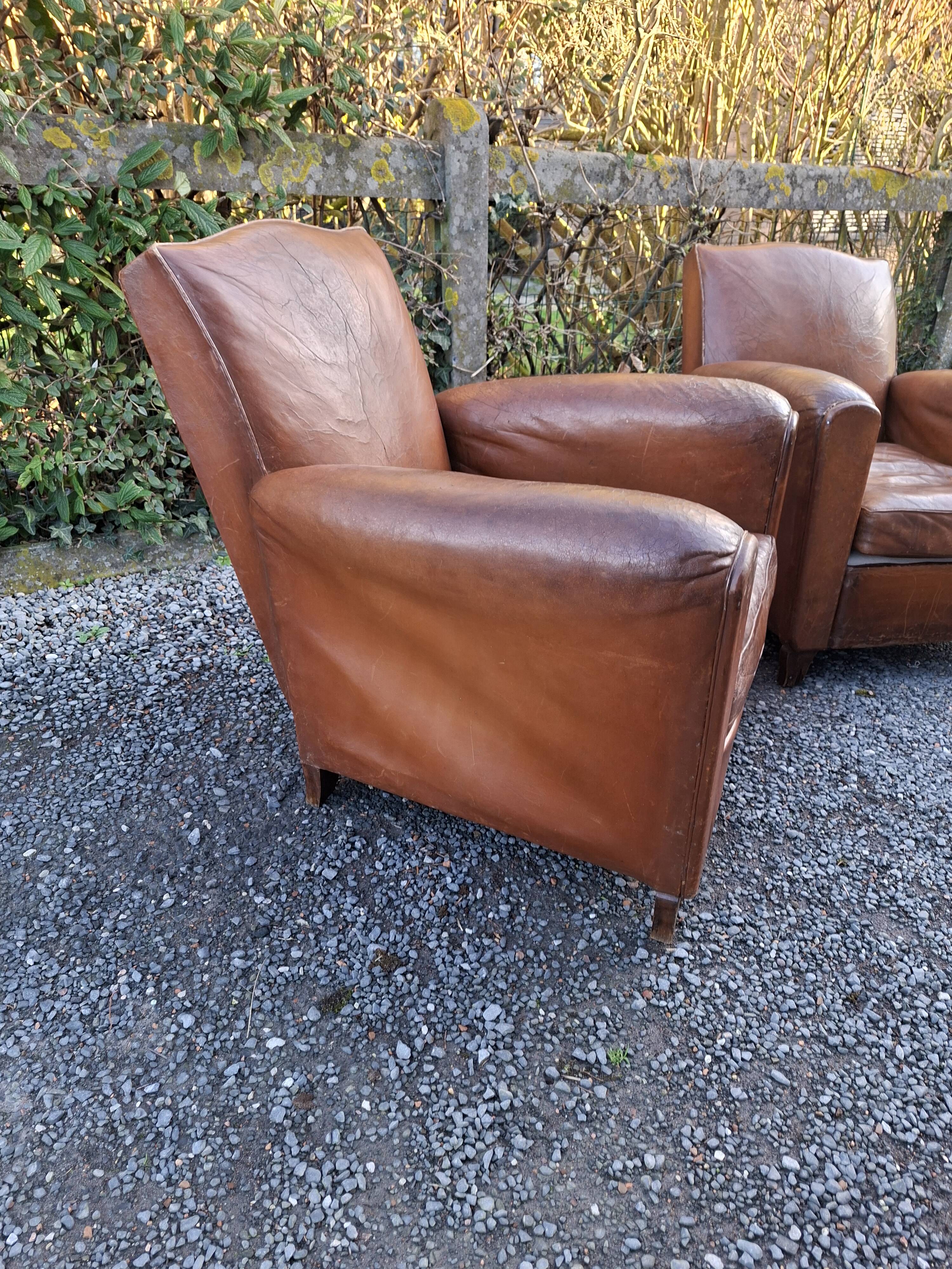 A couple of pairs of genuine restored club armchairs in industrial loft leather.