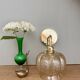 Vintage golden globe angled wall light in amber glass