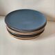 Set of 6 cream and grey-blue glazed earthenware plates.