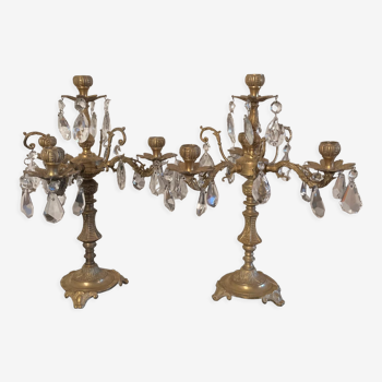 Duo of bronze candlesticks with tassels