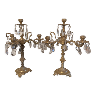 Duo of bronze chandeliers with tassels