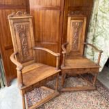 Pair of Renaissance style carved walnut armchairs