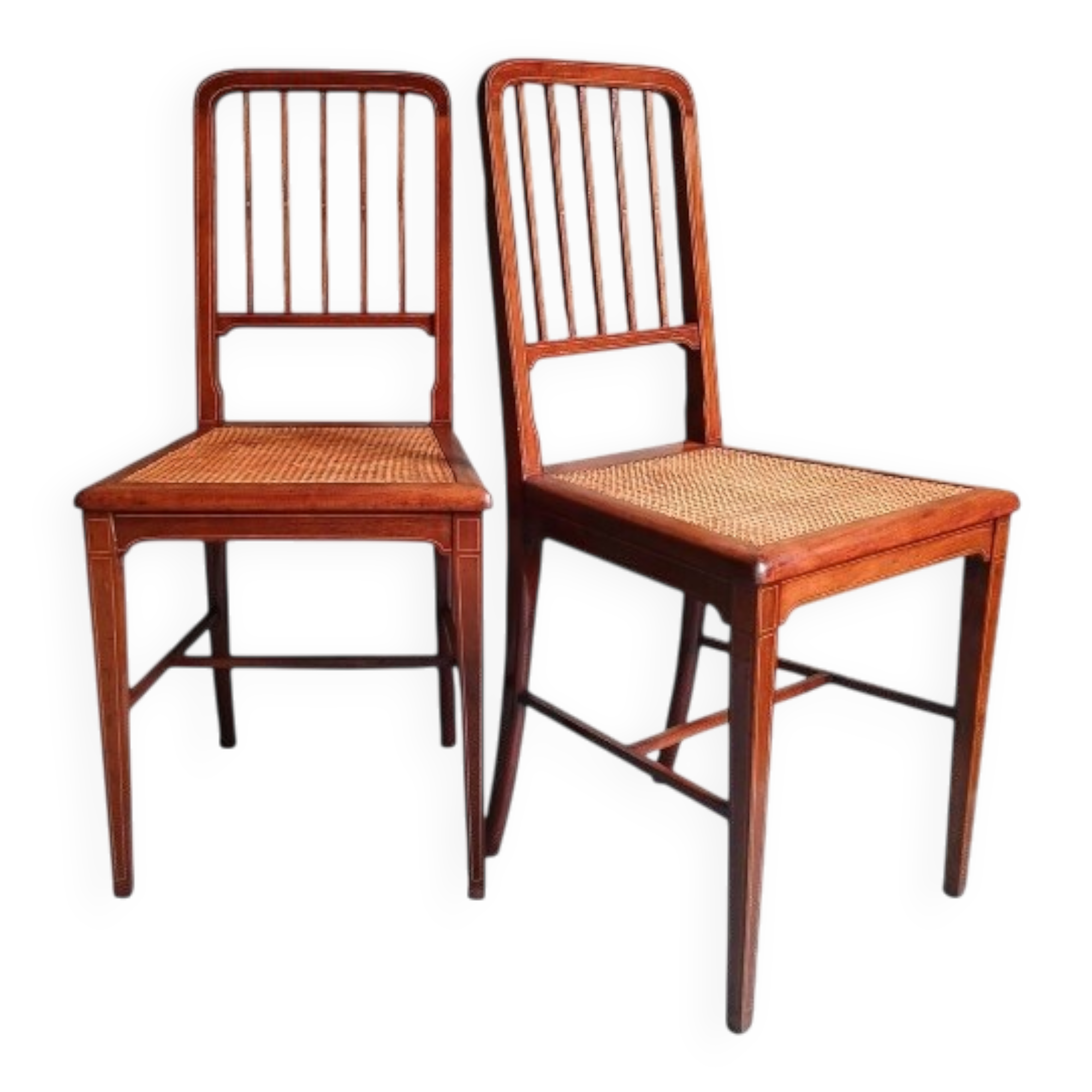 Pair of caned mahogany chairs, circa 1930.