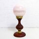 Turned wood and pink glass lamp