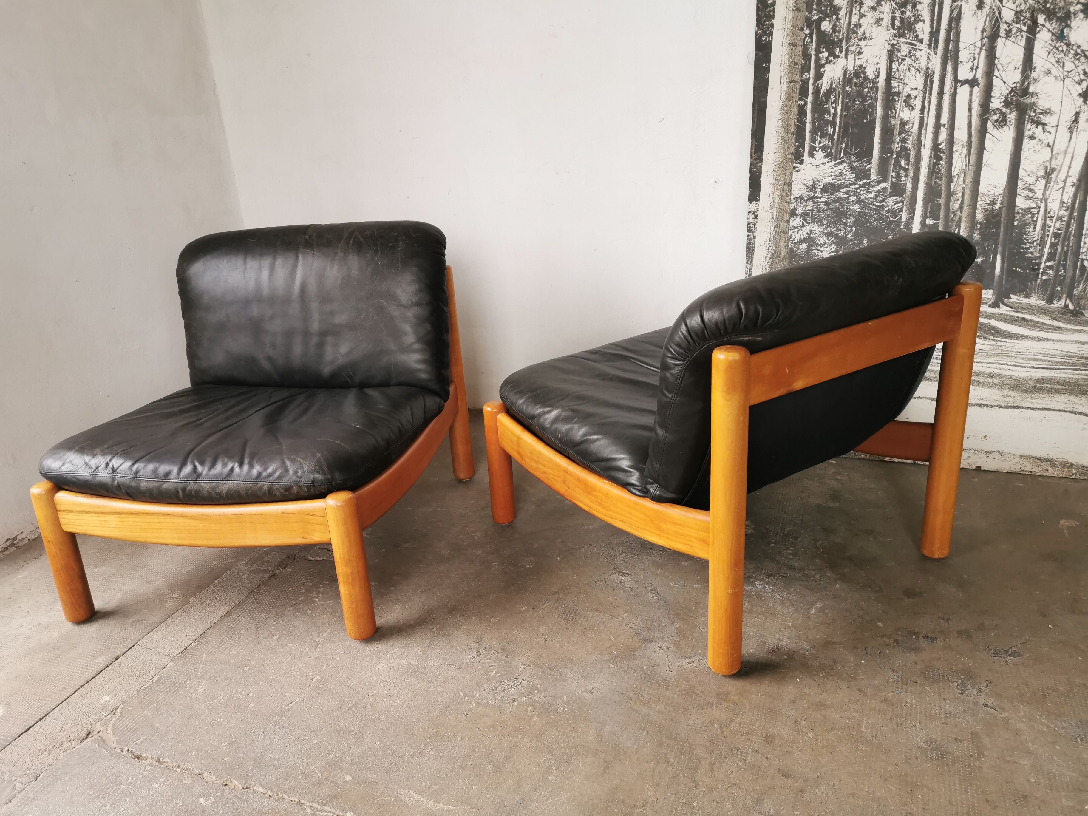 Pair of designer leather armchairs 80s