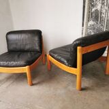 Pair of designer leather armchairs 80s