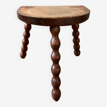 Low vintage wooden tripod stool