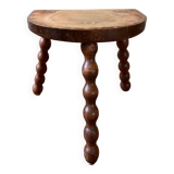 Low vintage wooden tripod stool