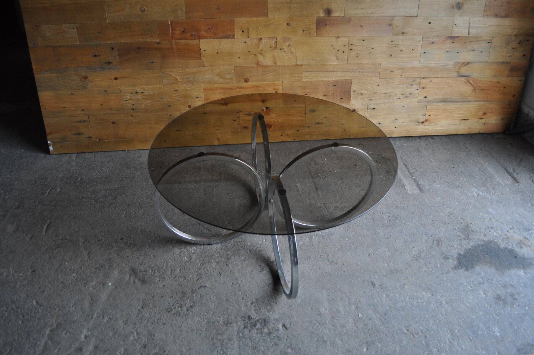 Vintage tubular coffee table in chrome with a transparent glass top, Mid-Century style 1960s.