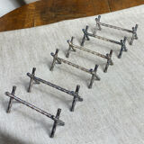 Six bamboo-patterned metal silver-plated knife rests.