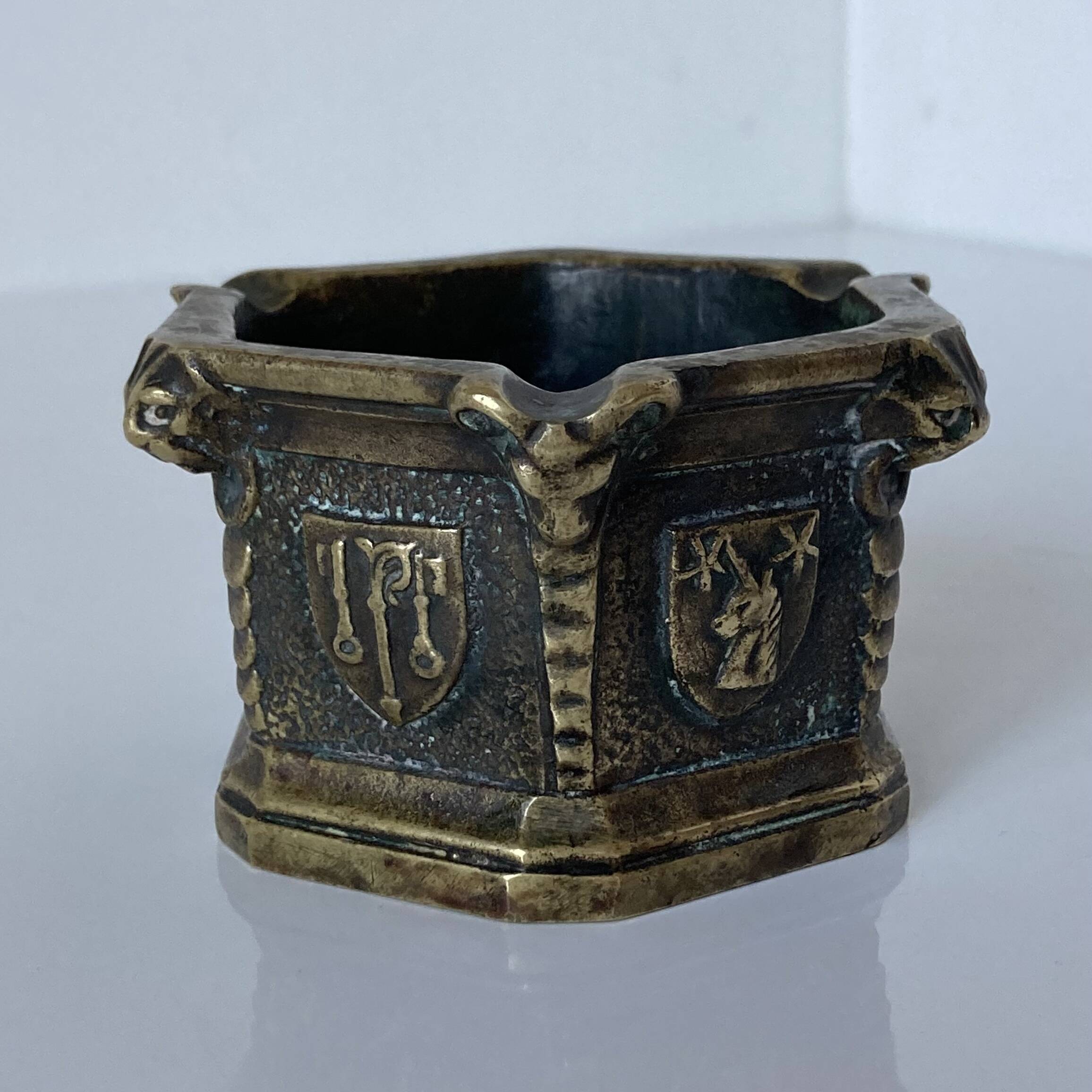 Gothic style bronze ashtray in the shape of a well with heraldic motifs by Max Le Verrier
