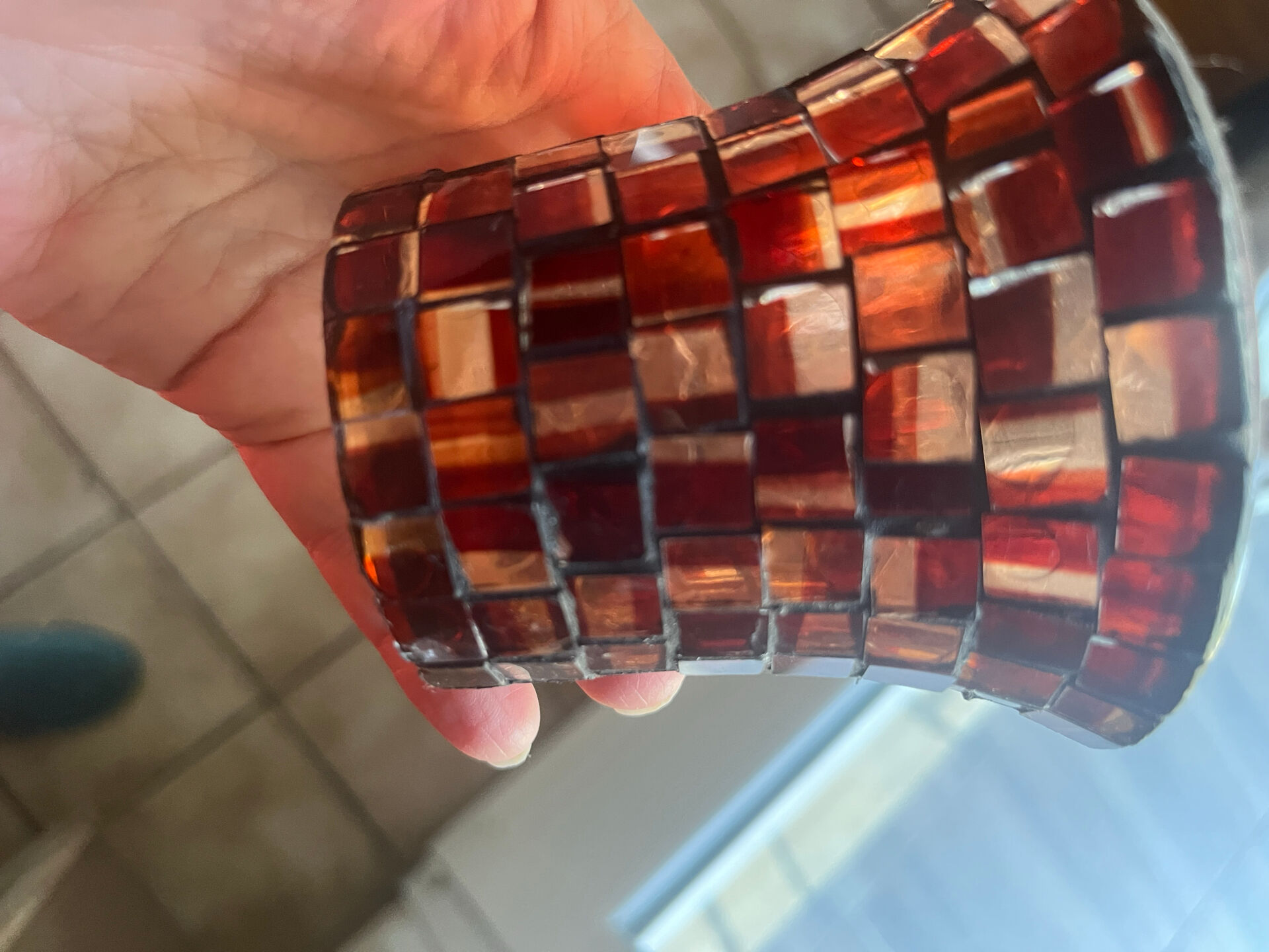 Three-branch candlestick in wrought iron and glass mosaic.