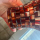 Three-branch candlestick in wrought iron and glass mosaic.