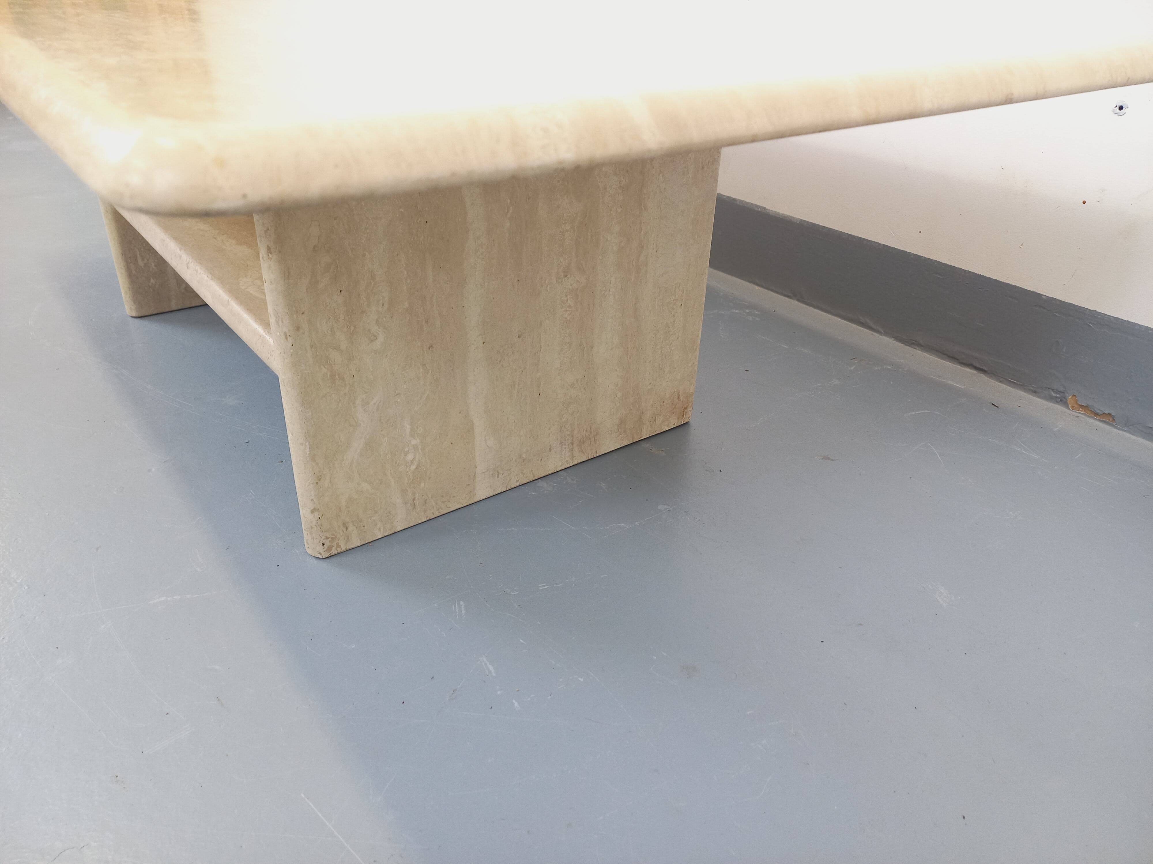 Vintage rectangular coffee table in travertine with magazine rack.